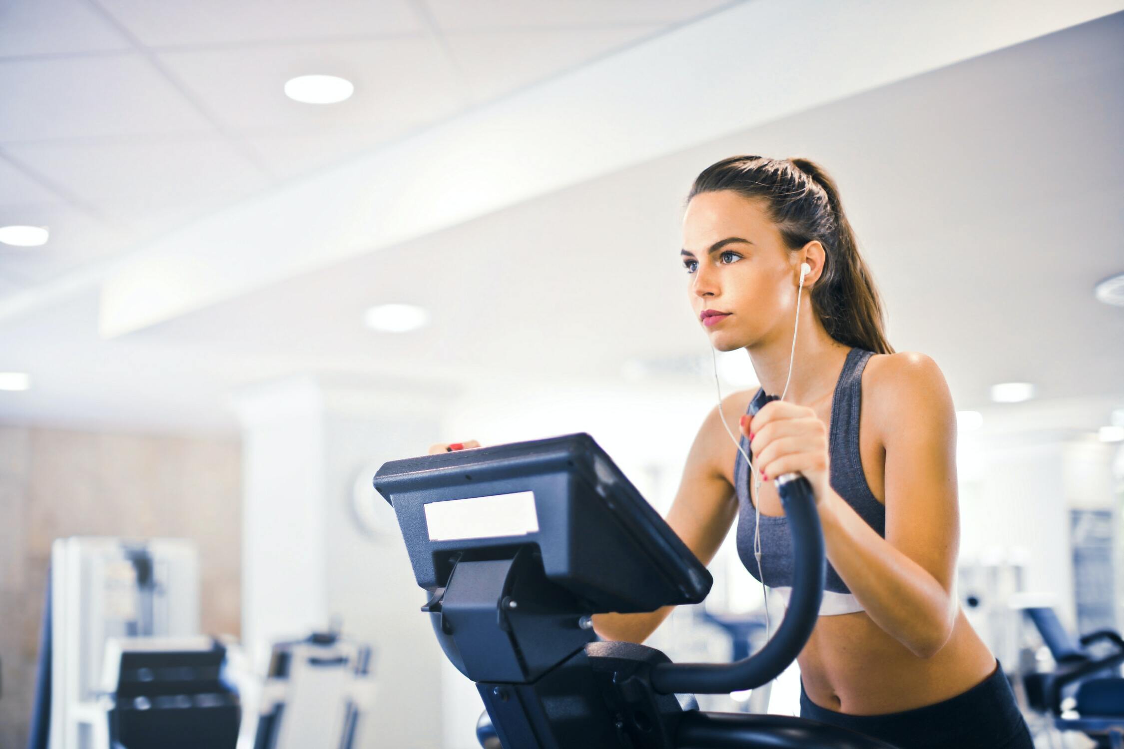 Woman on an elliptical exercising